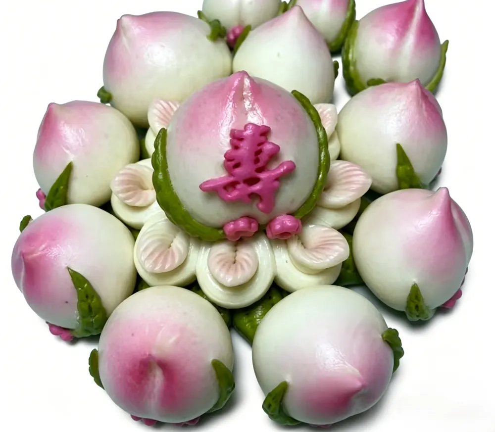 raditional steamed buns shaped like peaches, symbolizing longevity in Chinese culture.