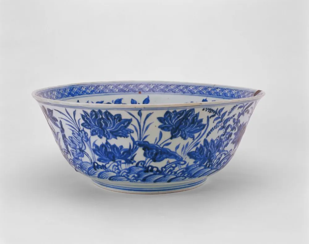 Ming Dynasty Tianshun period blue and white porcelain bowl decorated with hand-painted lotus pond floral motifs