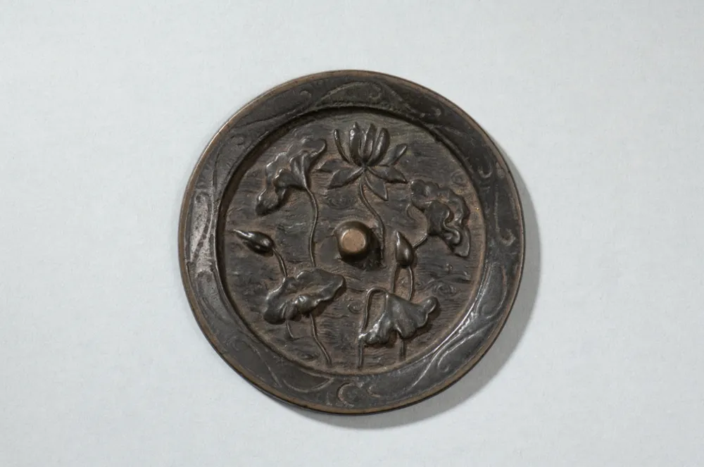Ancient Song Dynasty bronze mirror embossed with carved lotus pond floral pattern, Chinese lotus cultural artifact
