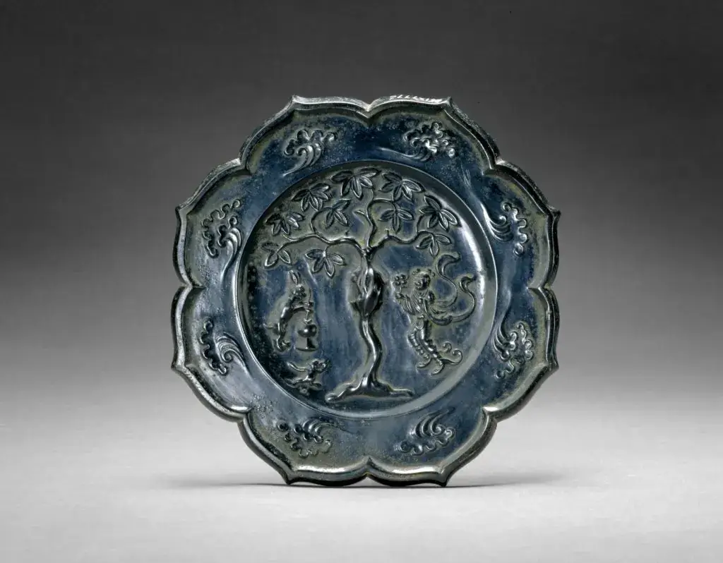 Tang dynasty rhombus bronze mirror carved with Moon Palace scene, lunar osmanthus tree, Chang'e and jade rabbit **Title**:Tang Bronze Mirror with Moon Palace and Lunar Osmanthus Carving
